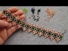 someone is making beaded jewelry with beads