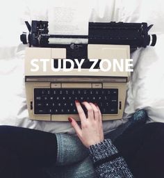 a woman typing on an old typewriter with the words study zone above her head