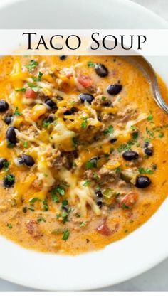 a white bowl filled with taco soup on top of a table