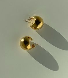 The Genevieve is for the classic girl- the perfect "quiet luxury" moment to add to your collection. Reminiscent of old Hollywood but updated for today, these earrings pair perfectly with classic tailoring or your favorite pair of jeans. Simple, bold, and perfect for everyone. 18K gold plating on stainless steel Water resistant, hypoallergenic Classic Single Clip-on Earring For Formal Occasions, Classic Huggie Earrings As Gift, Classic Formal Single Clip-on Earring, Classic Polished Earrings For Everyday, Classic Earrings With Polished Finish For Everyday, Luxury Everyday Small Hoop Earrings, Classic 14k Gold Earrings For Everyday, Classic Gold-plated Polished Clip-on Earrings, Classic Gold-plated Clip-on Earrings With Polished Finish