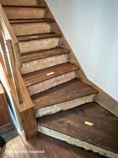 a wooden stair case with no carpet on it