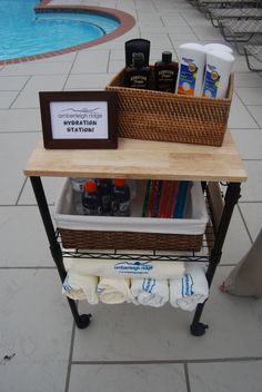 a table with some items on it next to a pool