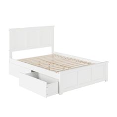 a white bed with two drawers underneath the headboard and foot board, on a white background