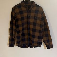 Brown And Navy Flannel Never Worn Great Condition Brown Flannel Shirt, Casual Brown Flannel Shirt, Casual Brown Flannel Shirt For Winter, Brown Flannel Button-up Top, Brown Flannel Tops For Fall, Casual Brown Flannel Tops, Casual Brown Long Sleeve Flannel Shirt, Casual Brown Winter Shirt, Brown Flannel Tops For Winter