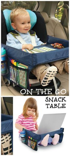 a child sitting in a car seat on the go snack table