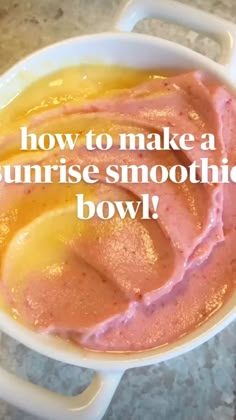 a bowl filled with pink and yellow smoothie