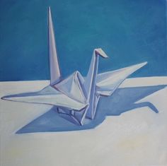 an image of a paper crane in the snow