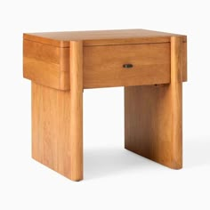 a small wooden desk with one drawer open