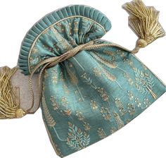 Designer Blue Shoulder Bag As Gift, Designer Blue Shoulder Bag For Gift, Luxury Embroidered Festive Bag, Luxury Embroidered Festive Bags, Gold Embroidered Ceremonial Bag, Ceremonial Gold Embroidered Bag, Festive Gold Designer Bags, Festive Designer Embroidered Bags, Gold Embroidered Bags For Ceremonial Occasions