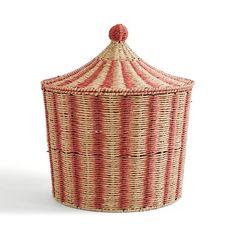 a red and white basket with a lid