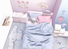 a small child's bedroom with pink walls and blue bedding on the floor