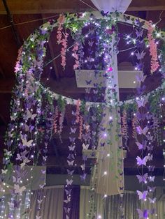 purple and white butterflies hanging from the ceiling