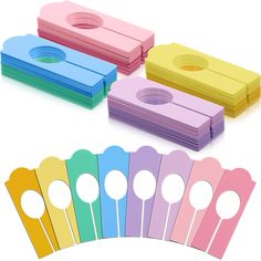 several different colored paper with circles on them