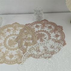 Description: Featuring vintage lace pattern design, this place mat is very beautiful and good-looking, which can decorate your table and countertop well and is a good choice for photo and scene settings. With its fine workmanship and attention to detail, this dinner mat will not wear easily and can be used for a long . It is constructed of polyester material. The diameter of this product is 30cm. This product is suitable for restaurants, dining tables, festivals, hotels, cafes, etc. Item Name: P Vintage Lace Pattern, Coffee Shop Supplies, Lace Pattern Design, Wedding Placemats, White Round Coffee Table, Lace Placemats, Victorian Table, Table Runner And Placemats, Lace Table