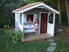 two girls inside their painted cedar playhouse Kids Garden Playhouse, Diy Kids Playhouse, Cedar Playhouse, Playhouse Diy, Childrens Playhouse, Garden Playhouse