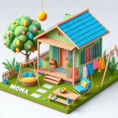 a paper model of a small house with swings and toys on the lawn next to it