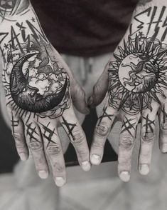 two hands that have tattoos on them with the sun and moon above them, all over their palms