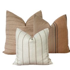 three pillows in different colors and sizes