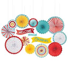 an assortment of colorful paper fan decorations hanging from strings with the words welcome to the carnival