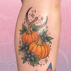 a woman's thigh with pumpkins and stars on it