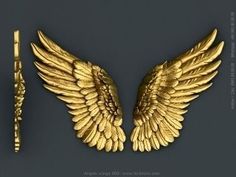 two golden wings and a pen on a gray background