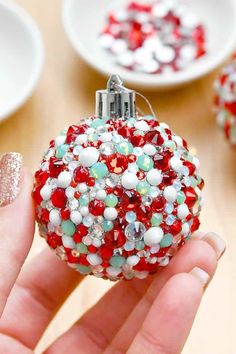 These gorgeous rhinestone Christmas ornaments will add just the right amount of twinkle to your Christmas tree! You'll want to use these DIY ornaments to deck the halls, the mantel, and everywhere else! Follow our simple step-by-step tutorial to create these dazzling ornaments in all your favorite colours and add some extra shimmer to your holiday decor. Such an easy Christmas craft for teens, adults, and seniors.