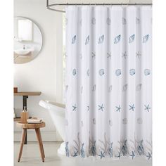 a shower curtain with shells and starfishs on it in a white room next to a bathtub