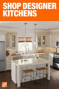 a kitchen with white cabinets and an orange banner over it that says shop designer kitchens