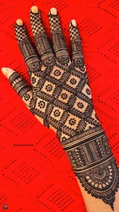 the hand is decorated with intricate designs