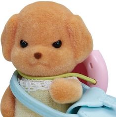 a teddy bear with a bib around its neck