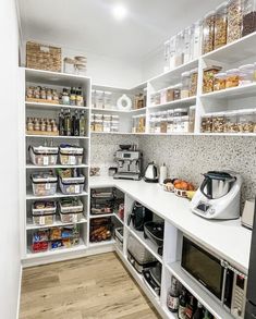 an organized pantry with lots of food in it