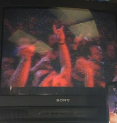 an old sony television sitting on top of a table