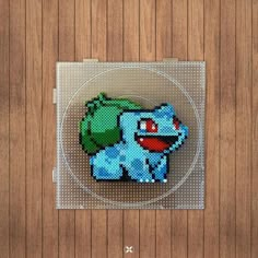 an image of a pixel art piece on a wooden surface