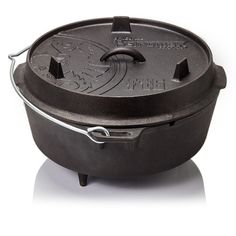 an oval cast iron dutch oven on a white background