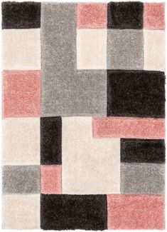 an area rug with different colored squares on the floor and one in black, white, pink