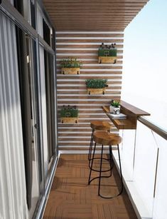 a small balcony with plants on the wall and wooden flooring, as well as an instagram post