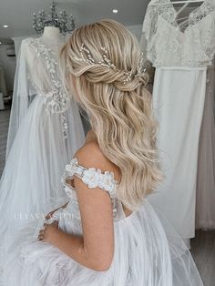 the back of a woman's head wearing a wedding dress