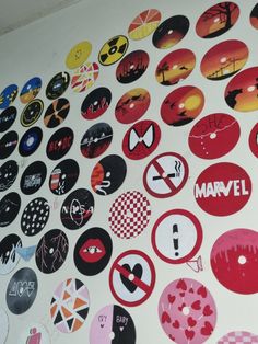 many different stickers are on the wall next to each other in various colors and shapes