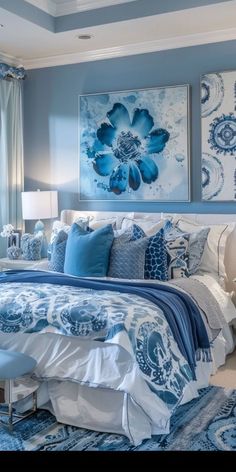 a bedroom with blue and white decor on the walls