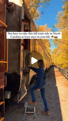 a woman standing on a step stool next to a train with the caption you have to take this rail ride in north carolina at least once in your life