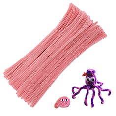 an octopus toy next to some pink yarn