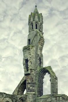 an old stone building with a clock tower