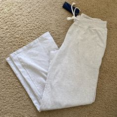 Lowrise Cozy Cotton Sweatpants With A Drawstring Waist, And Flared Legs. Fabrics: 100% Cotton Measurements: Waist 28" (71 Cm), Rise 9" (23 Cm), Inseam 32" (81 Cm) Made In: China Gray Sweatpants Women, Brandy Melville Outfits Sweatpants, Eminem Daughter, Brandy Melville Pjs, Sweatpants Brandy Melville, Brandy Clothes, Flare Sweat Pants, Brandy Melville Clothes, Brandy Sweats