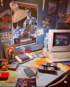 there is a computer and other items on the desk