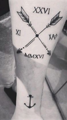 an arm with two arrows and the words xxvi in roman numerals on it