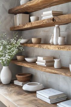 some shelves with books and vases on them