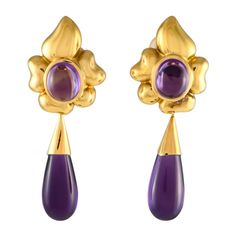 Opulent 18K Yellow Gold and captivating Amethyst gemstones come together beautifully on these enchanting earrings. Each one measures 2.5 long by 0.85 long, making them an ideal size for any occasion.This jewelry piece is offered in estate condition and includes a gift box.e Amethyst Flower, Flower Drop Earrings, Deco Luminaire, Bracelet Love, Style Deco, Baccarat, Amethyst Gemstone, Hermes Birkin, Girls Best Friend