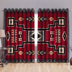 a living room scene with focus on the curtains and rugs that are hanging in front of the window