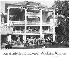 black and white photograph of people standing in front of riverside boat house, virginia, kansas