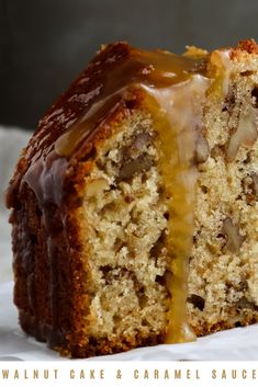 a close up of a piece of cake with icing and nuts on the inside